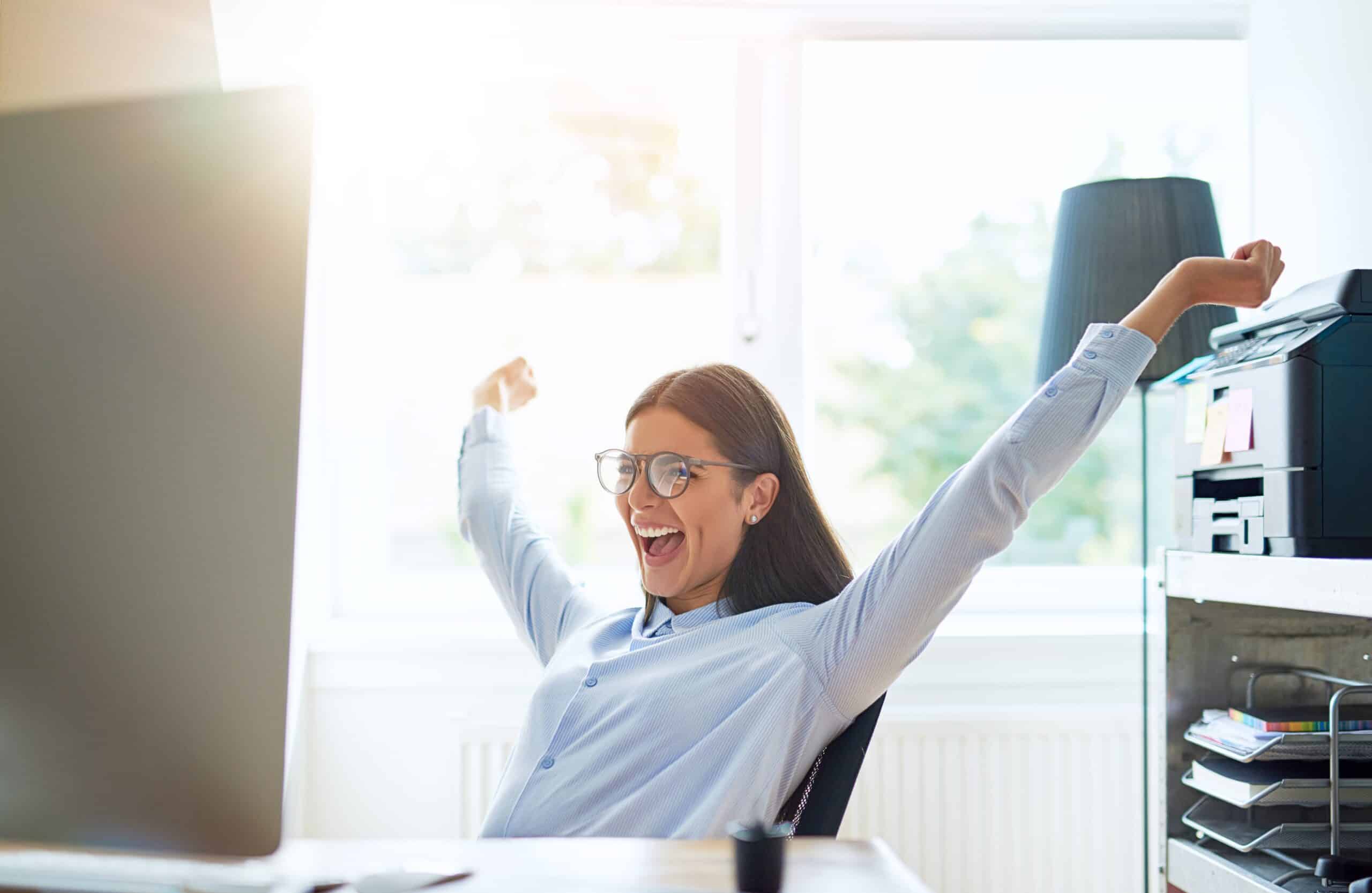 Woman in happy mood in the office