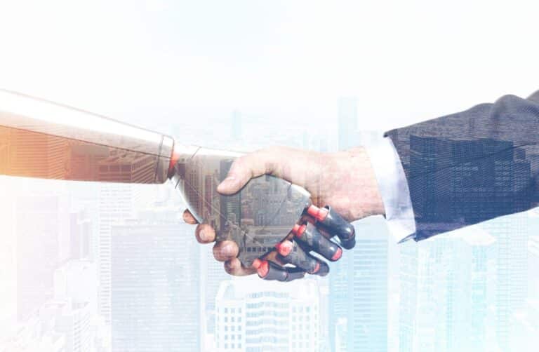 Robot AI hand and human hand engaging in a handshake working together